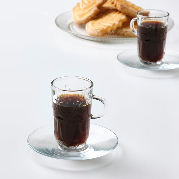 Glass mugs with coffee/tea & pastries.