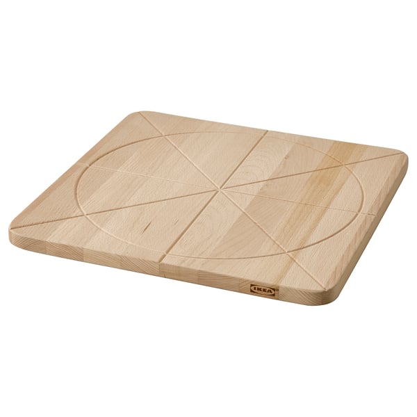 Ikea SÅPÖRTMAL wooden cutting board, light beige, rectangular with engraved geometric design.