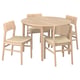 A light-brown scandinavian-style dining set with a round table and four wicker-clad chairs.