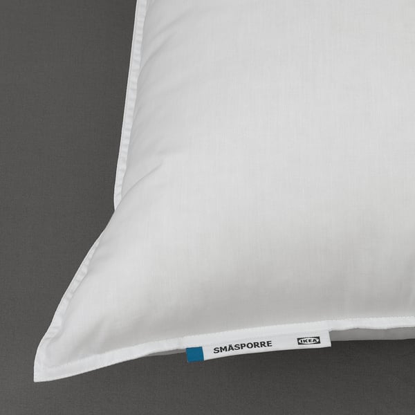 White pillow with SMÅSPORRE label on edge, soft yet supportive, ideal for back or side sleepers.