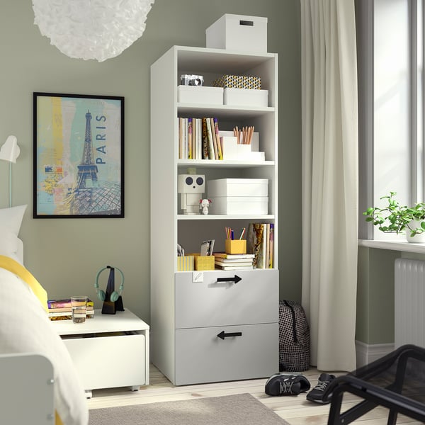 Grey SMÅSTAD kids bookcase with shelves, drawers, and paris poster.