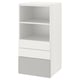 White SMÅSTAD bookcase with shelves and drawers for storage in small spaces.