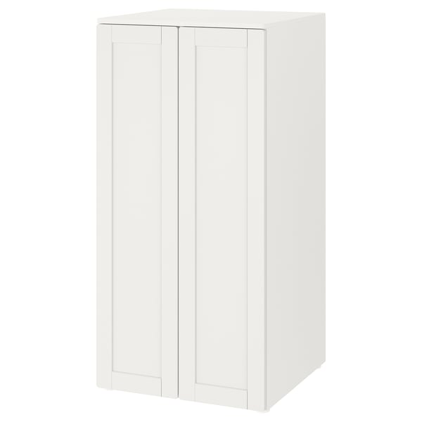 A white SMÅSTAD storage cabinet with two doors. It stands upright, made from fibreboard and particleboard, designed for storing childrens items.