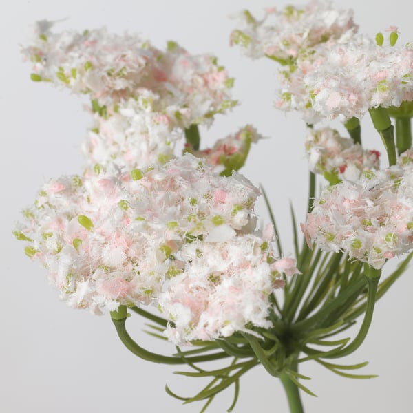 Artificial flower bouquet, soft white, delicate green centre, realistic texture, arranged for clear view.