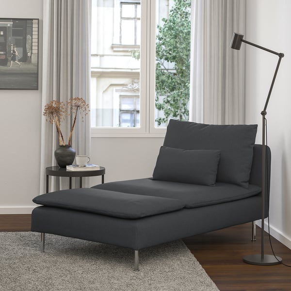 Modern SÖDERHAMN chaise with dark pillows in bright room.