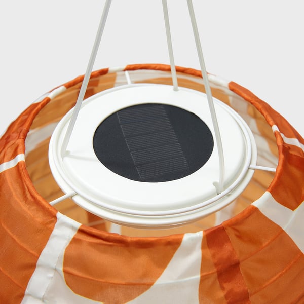 Solar-powered hanging lamp with orange and white shade, circular solar panel at top.