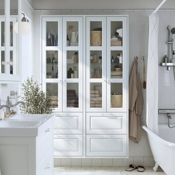 White TÄNNFORSEN bathroom cabinet - tall, multi-shelf & drawer, glass doors, space-saving.