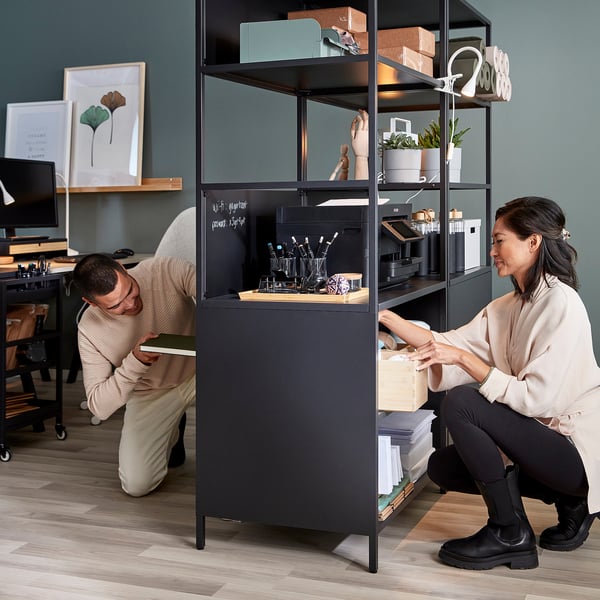 Organising TROTTEN storage unit with shelves and compartments for workspace.