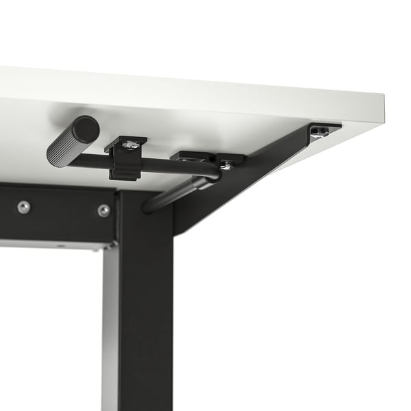 Close-up of a sturdy, height-adjustable standing desk mechanism with crank handle and metal frame.