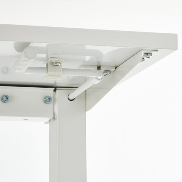 Close-up of adjustable sit-stand table mechanism.