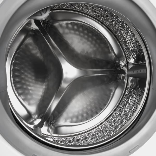 Washing machine drum with water flow showing. Designed for efficient, adjustable washing with steam programme and various settings.