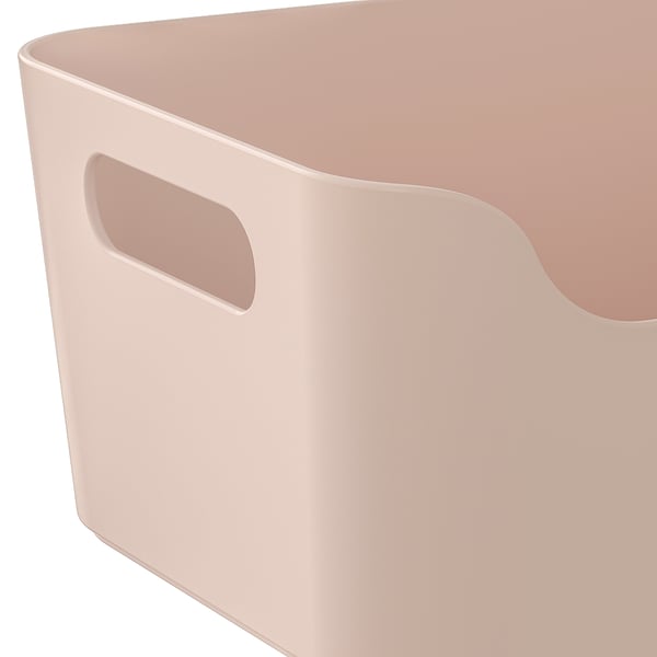 Light pink storage bin with handle, smooth surface, two handles for easy carrying.