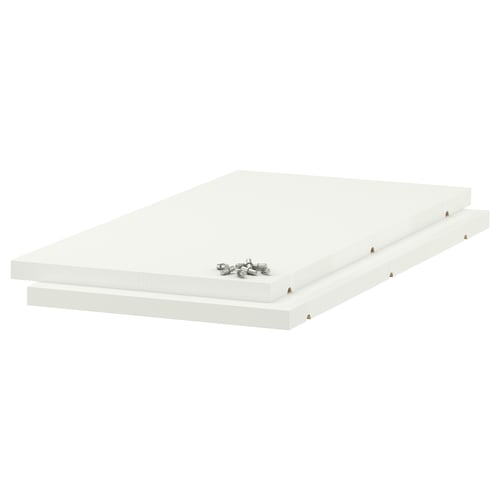 A set of white UTRUSTA melamine shelves, rectangular in shape and strong, ready to be assembled.