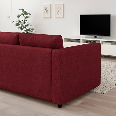 Red VIMLE sofa in living room with tv and plant.