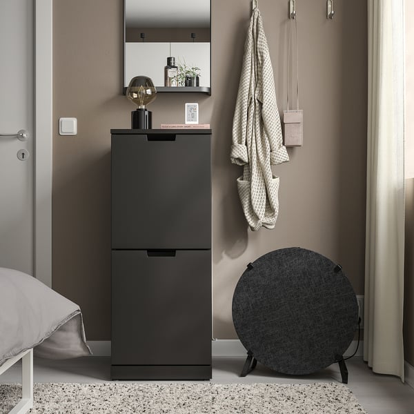 VINDSTYRKA air sensor on cabinet, monitors air quality, temperature, humidity, pollutants, connects to smart home.