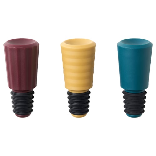 Tre färgglada flaskproppar i silikon och plast; Röd, gul, blå, räfflad design.