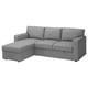 En grå BÅRSLÖV bäddsoffa med schäslong. Den har mjuka former och stora kuddar, perfekt för avkoppling.