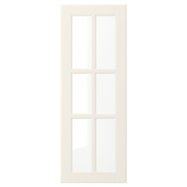 En vit BODBYN-dörr med en design med sex paneler, slät lackerad yta och paneler i härdat glas, som erbjuder en traditionell och ren estetik.
