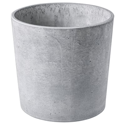 Cylindrisk grå betongkruka med naturliga fläckar, mjuka fötter, för inomhus/utomhusbruk.