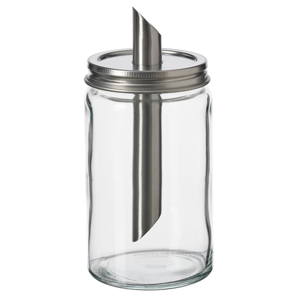 En tom, genomskinlig sockerkarkar, med lock i rostfritt stål och innertub i metall, designad av IKEA.