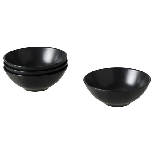Svarta keramikskålar, stapelbara, matt yta, rund form, enkel design.