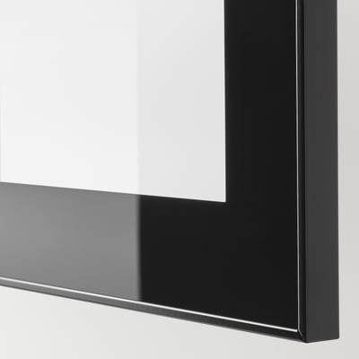 Närbild av blank svart GLASSVIK-ram med klart glas som reflekterar ljus och visar högkvalitativ finish.