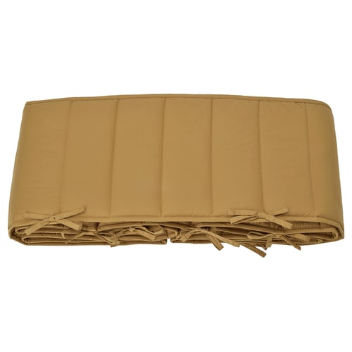 Beige GULDVÄVARE sängfångare, rektangulär, vadderad, knuten med band för fastsättning.
