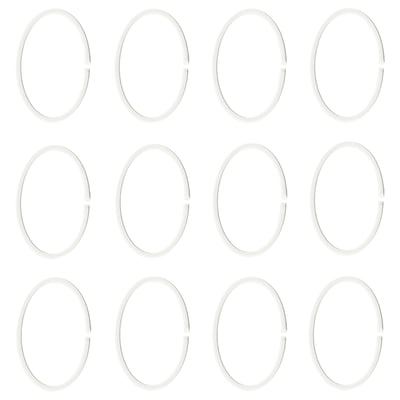 Tolv vita ovala plastringar visas i rader.