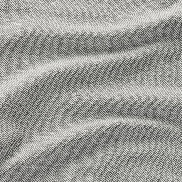 Bilden visar mjukt, reflekterande chenilletyg i närbild, vilket framhäver dess slitstarka och lätt glänsande struktur.