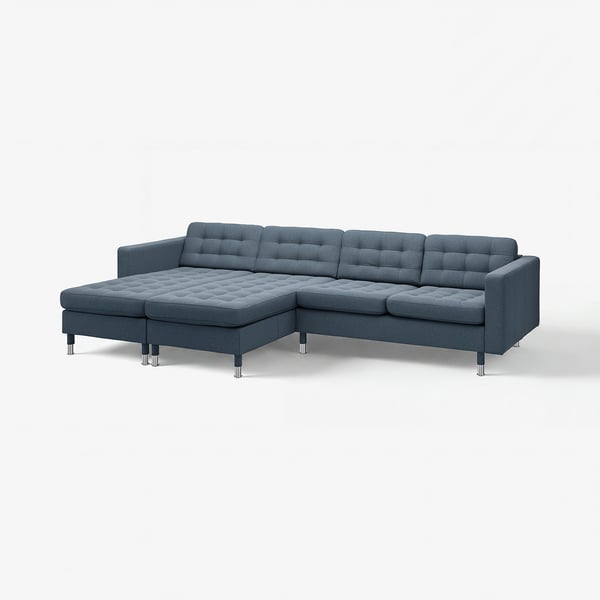 Modern grå sektionssoffa med kromade ben, tuftad design och avtagbara armstöd.