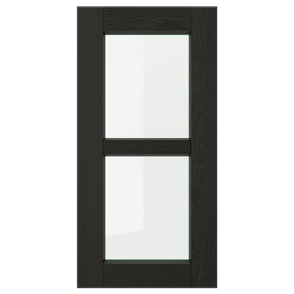 Detta är en LERHYTTAN svart kökslucka med träram, fasade kanter och panel i härdat glas.