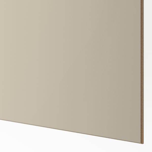 Närbild av elegant, slät skjutdörrspanel med beige finish. Högkvalitativ konsistens, hållbar och snygg.