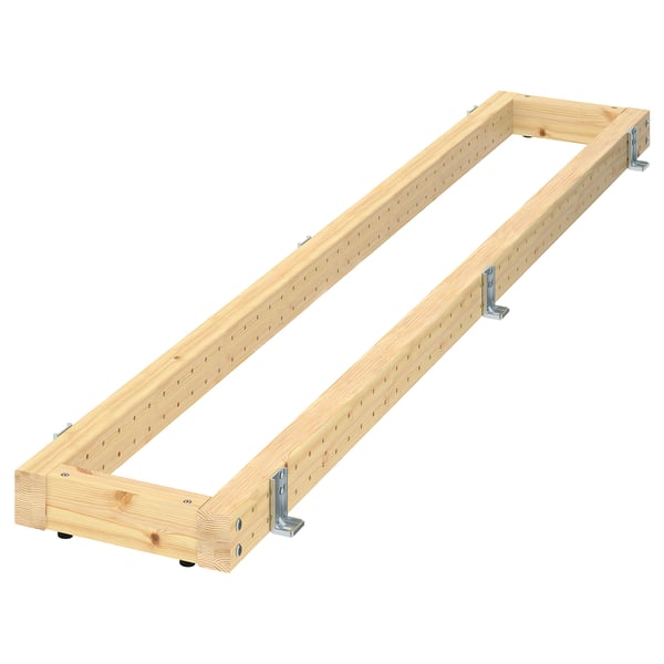 En METOD förankringsram för trägolv. Den är ljusbrun, rektangulär och har justerbara metallfästen för utjämning.