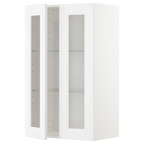 Ett vitt ikea METOD köksskåp med glasdörrar i modern design.