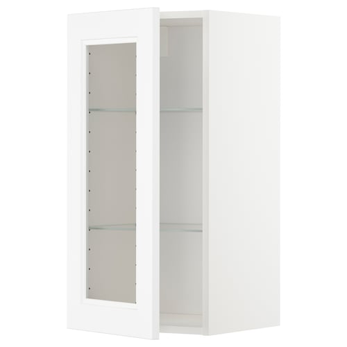 Ett vitt METOD köksväggskåp med glashyllor, modern design.