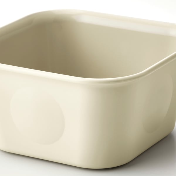Liten, beige förvaringslåda i plast, ren och slät yta. Enkel, fyrkantig design.