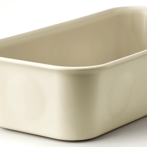 Slät, krämfärgad plastbehållare, rektangulär med lätt rundade kanter, designad för att organisera små föremål.