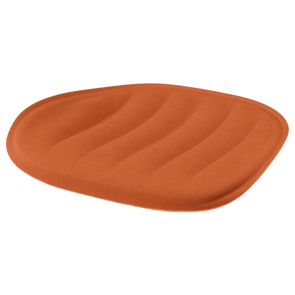 Rostfärgad, oval sittdyna med vågig design för komfort.