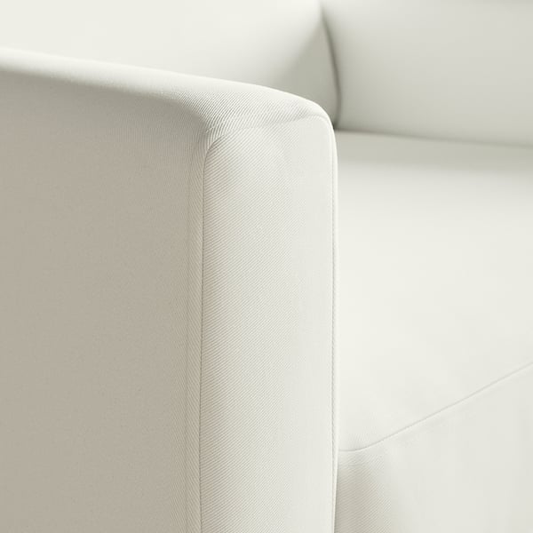 En slank, modern soffa med ett lätt, texturerat tyg, som visar upp högkvalitativ design och komfort.
