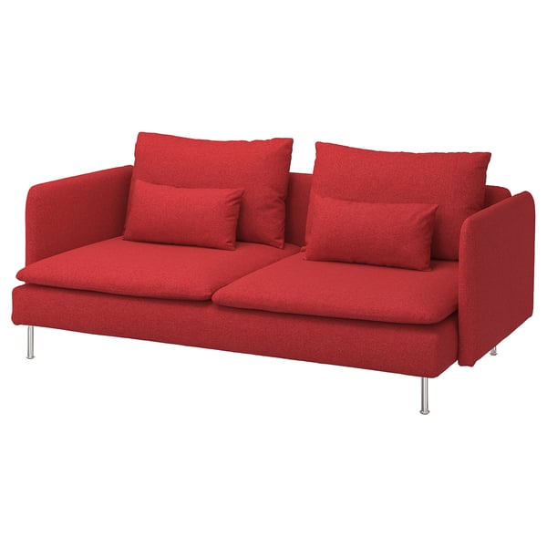 Modern l-formad soffa i rött tyg med fyra kuddar på metallben.