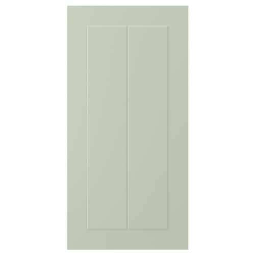 En STENSUND grön skåpdörr med räfflade paneler, tillverkad av träfiberskiva och polyuretanfärg, rektangulär till formen med en elegant design.