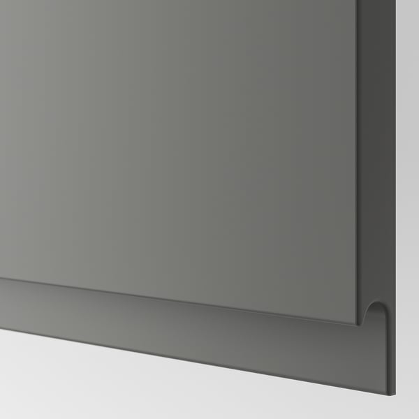 Närbild på elegant, modern lådfront med integrerat handtag, slät matt yta.
