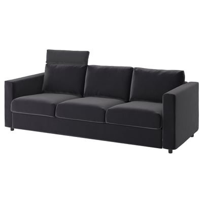 En modern VIMLE soffa i mörkgrått. Den har en elegant design, tre kuddar och ett nackstöd för komfort.