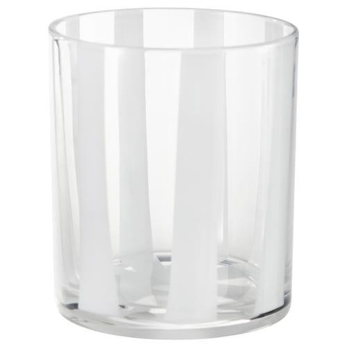 En VINDSTILLA klar glas, cylindrisk ljusstake med vertikala ränder och en texturerad bas.