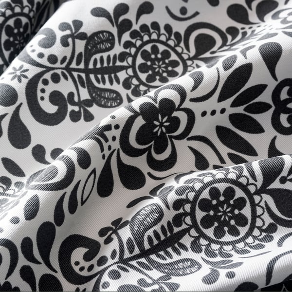Black and white floral patterned fabric, high quality fabric texture visible.