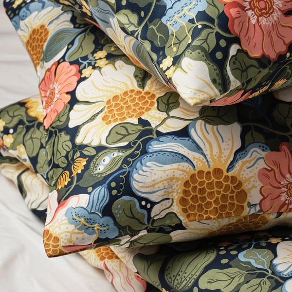 Vibrant floral pillows, sateen-woven, soft & luxurious. Dark blue base with rich, colourful flowers.