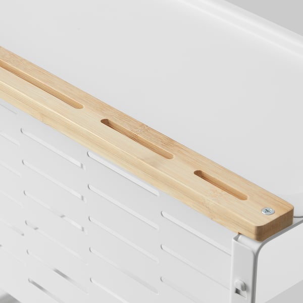 Wooden knife holder with slots for blades. Mounts on a white wall rack.