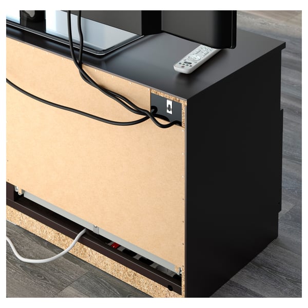 Tv bench with cable management and remote storage on top.