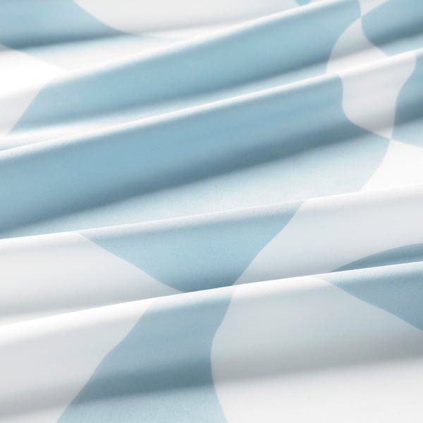 Soft, blue-white patterned bed sheet, folded smooth, showcasing quality texture.