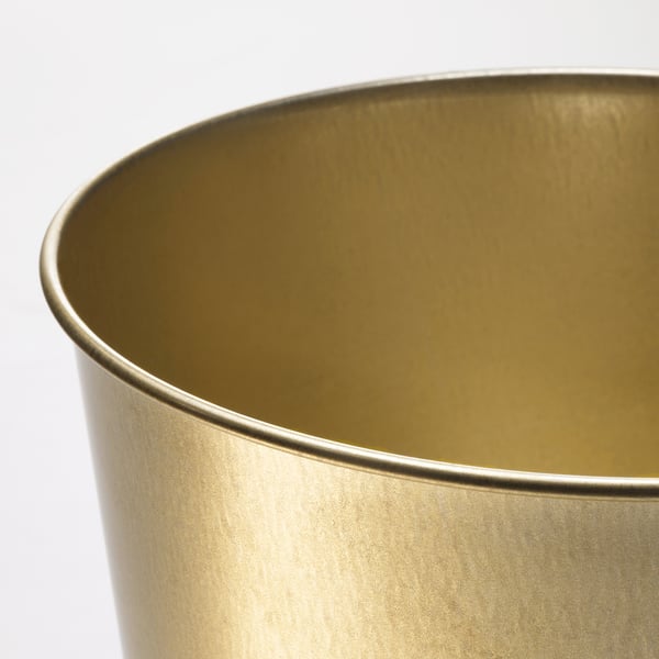 Close-up of a golden, metallic planter showing its smooth texture and sleek finish.